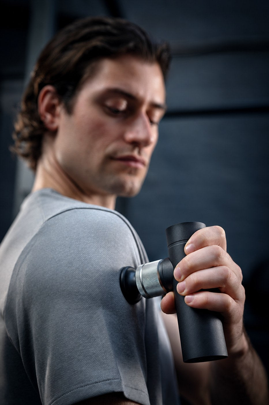 Unbranded mini massage gun — illustrative edited reference image 2